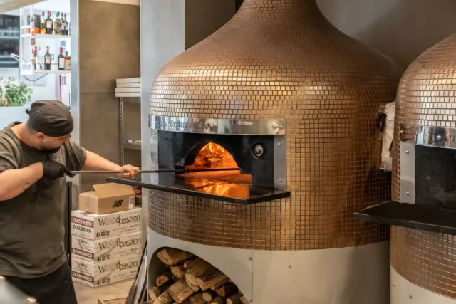 Pizza chef at work zoomed out
